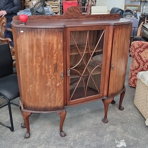 870 - Mahogany display cabinet with bow front design and glazed central door. Features curved legs with cl... 