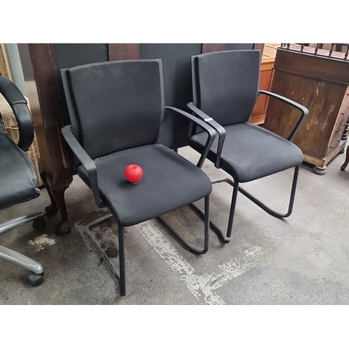 872 - A pair of Steelcase office chairs with black fabric upholstery and metal frames. Similar online for ... 