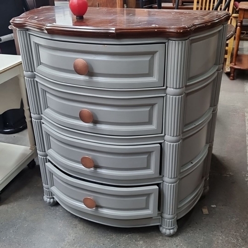 966 - A four drawer chest with curved front, painted in gray with wood top and copper circular handles.