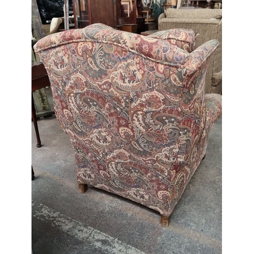 967 - A very plush vintage upholstered wingback armchair with down feather stuffed back and seat cushions ... 