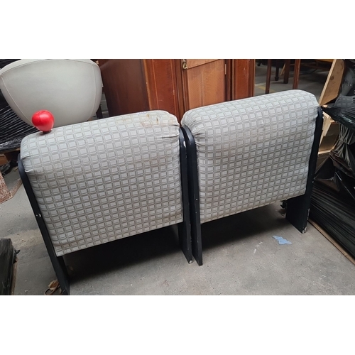 853 - Pair of mid-century modern fabric upholstered chairs with black metal frame detailing. The chairs fe... 