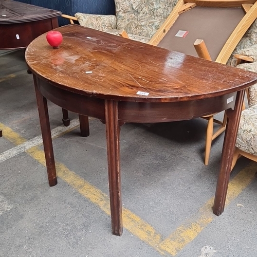 854 - A vintage Mahogany demi-lune table with square tapered legs.