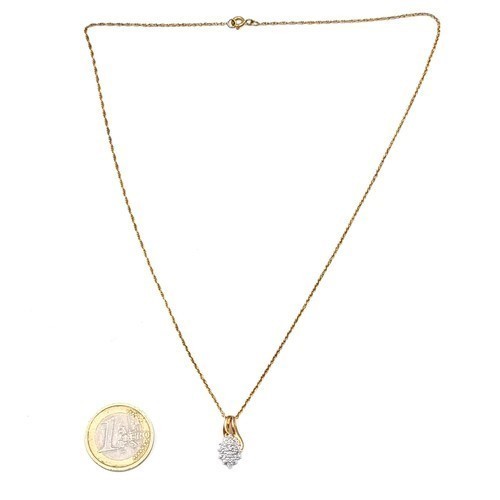 980 - Star Lot : A very pretty diamond set pendant and chain hallmarked nine carat gold. Length of chain -... 