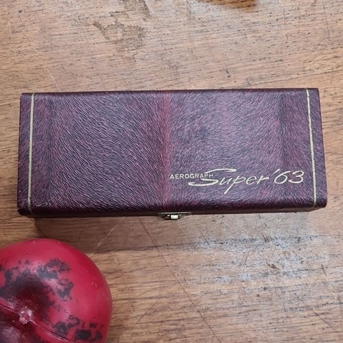 992 - An Aerograph Super 63 airbrush vintage tattoo gun in original velvet-lined case, c. 1960s. Precision... 