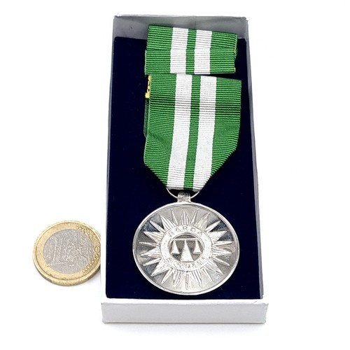 5 - An original unnamed  Garda Siochana long service medal together with two bars and box. Awarded after... 