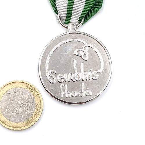 5 - An original unnamed  Garda Siochana long service medal together with two bars and box. Awarded after... 