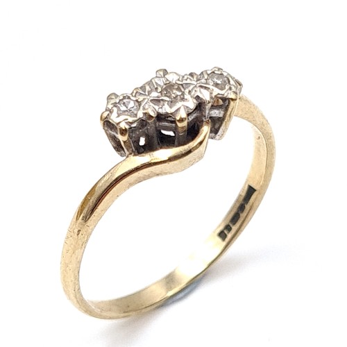 7 - A three stone illusion set diamond ring with twist mount hallmarked nine carat gold (375). Ring size... 