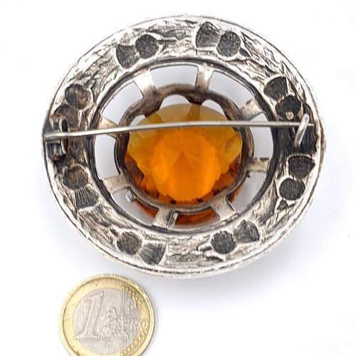 12 - A very nice example of a large Scottish amber gemstone brooch set with Scottish Thistle. Dimensions ... 