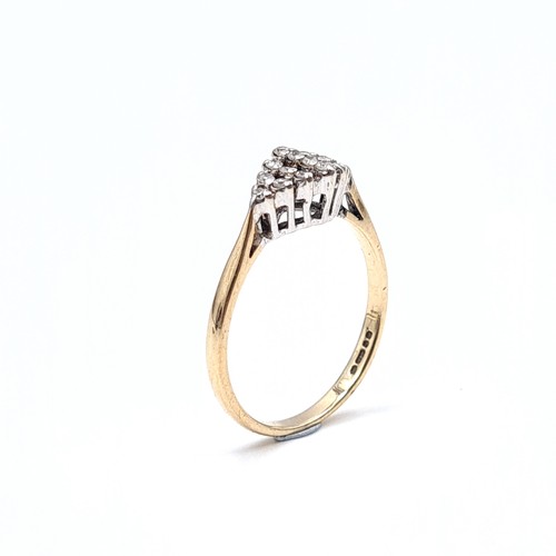 21 - A pretty diamond ring set in nine carat gold - 375. (Est weight of diamonds - 0.15 carats) Ring size... 