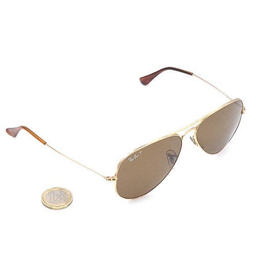 29 - A pair of original gold metal framed marked Ray-Ban aviator style sunglasses. Comes in a pouch.