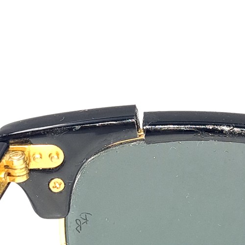 31 - A pair of rare folding sunglasses by Ray-Ban with gold metal detailing with original case.