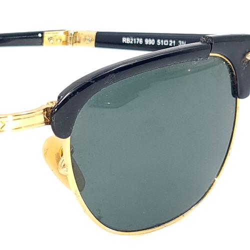 31 - A pair of rare folding sunglasses by Ray-Ban with gold metal detailing with original case.