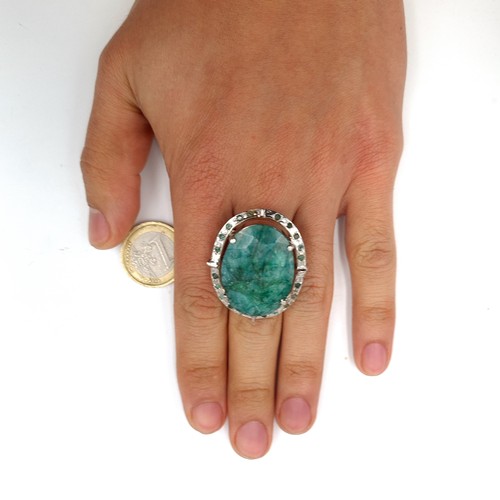 45 - Star lot : A huge natural emerald ring with emerald gemstone surround. Set in Sterling Silver Weight... 