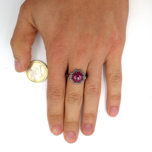 50 - Star Lot : A beautiful cabochon ruby & diamond ring. Ruby - 4.4 carats. Diamond - 0.35 carats. Ring ... 