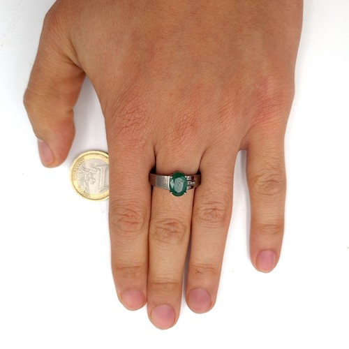 51 - Star lot : A natural emerald and diamond set ring mounted in sterling silver. Emerald - 1.8 carats. ... 