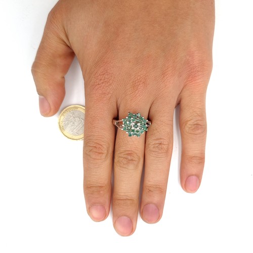 54 - A lovely emerald cluster ring set in sterling silver  Ring size - W. Weight - 5.31 grams. Boxed.  Br... 