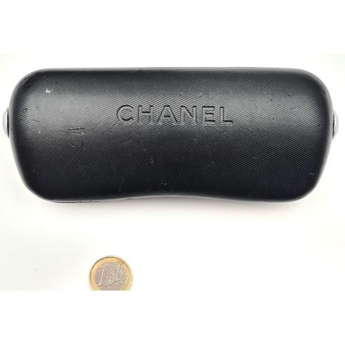 881 - A pair of outstanding Chanel sunglasses in as new condition in original tags. Together with case and... 