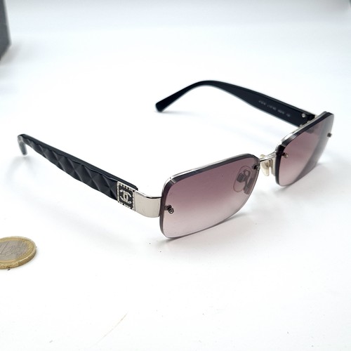 881 - A pair of outstanding Chanel sunglasses in as new condition in original tags. Together with case and... 