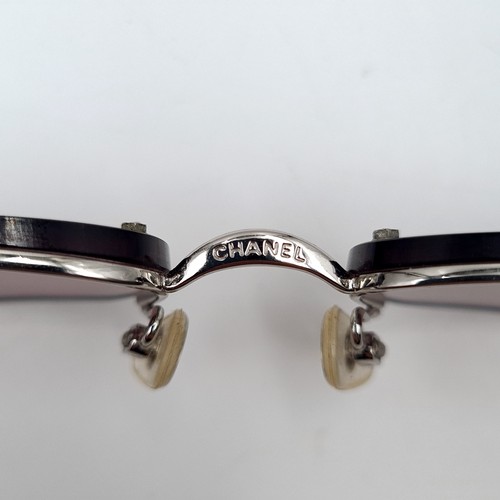 881 - A pair of outstanding Chanel sunglasses in as new condition in original tags. Together with case and... 