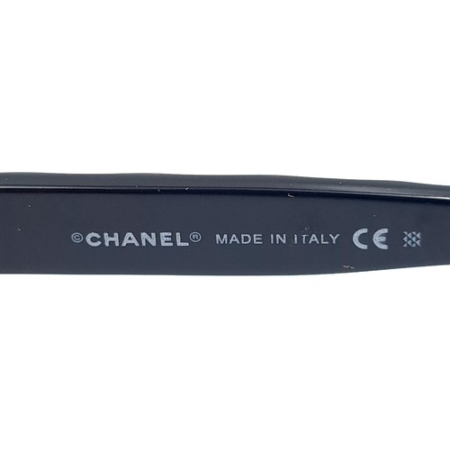 881 - A pair of outstanding Chanel sunglasses in as new condition in original tags. Together with case and... 