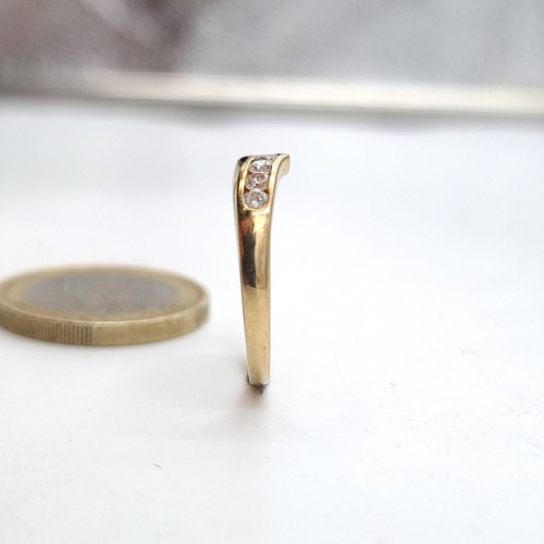 934 - A nine carat gold gem set wishbone ring. Size - N. Weight - 1.36 grams. Boxed.