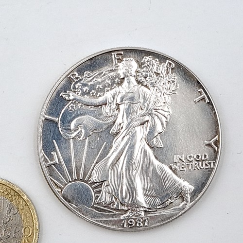 950 - A United States of America 1987 Liberty walking American silver eagle in one ounce fine silver and u... 