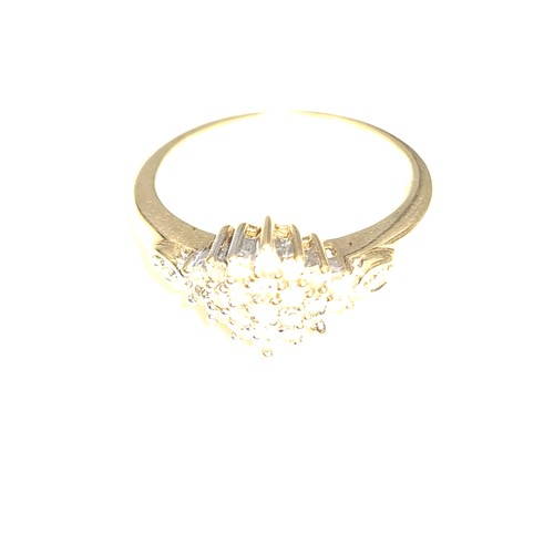 938 - A lovely vintage diamond cluster ring. Est weight of diamonds - 0.4 carats set in nine carat gold. R... 