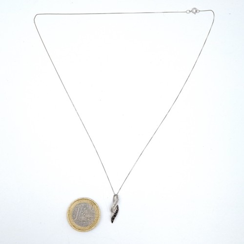 948 - A fine 9ct whit gold chain with a 9ct white gold pendent with black and white diamonds.  - 46 cms. B... 