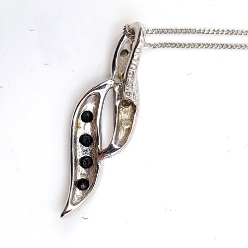 948 - A fine 9ct whit gold chain with a 9ct white gold pendent with black and white diamonds.  - 46 cms. B... 