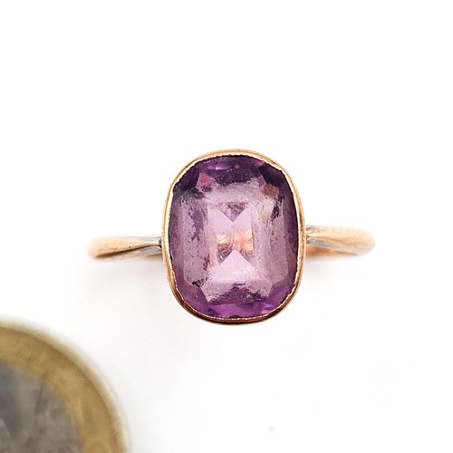 939 - Star Lot : An amethyst stone ring set in nine carat gold. Ring size - Q. Weight - 2.43 grams. Boxed.