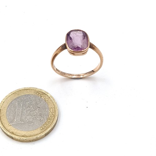 939 - Star Lot : An amethyst stone ring set in nine carat gold. Ring size - Q. Weight - 2.43 grams. Boxed.