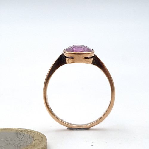 939 - Star Lot : An amethyst stone ring set in nine carat gold. Ring size - Q. Weight - 2.43 grams. Boxed.