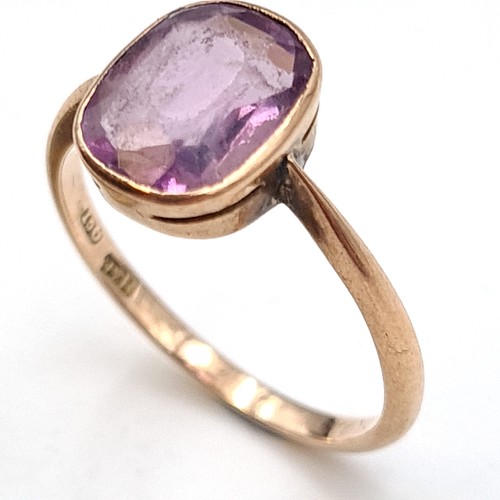 939 - Star Lot : An amethyst stone ring set in nine carat gold. Ring size - Q. Weight - 2.43 grams. Boxed.