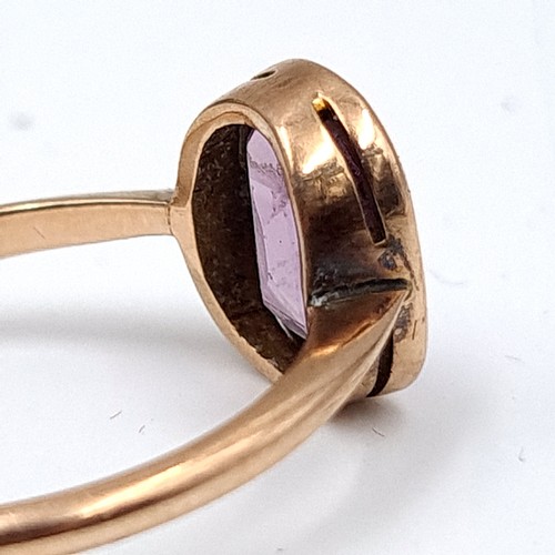 939 - Star Lot : An amethyst stone ring set in nine carat gold. Ring size - Q. Weight - 2.43 grams. Boxed.