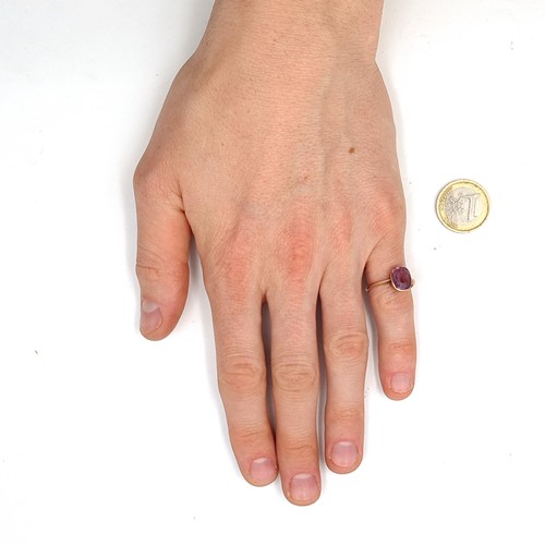 939 - Star Lot : An amethyst stone ring set in nine carat gold. Ring size - Q. Weight - 2.43 grams. Boxed.