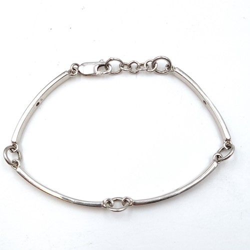 940 - A sterling silver twist link bracelet with 4 natural Diamonds one in each section . Weight - 8.28 gr... 