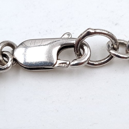 940 - A sterling silver twist link bracelet with 4 natural Diamonds one in each section . Weight - 8.28 gr... 