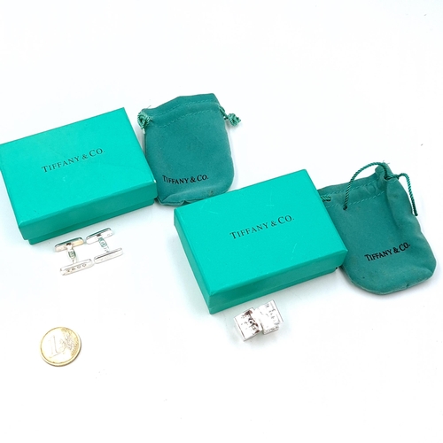 10 - Two pairs of Tiffany sterling silver cuff - links in original boxes. Weight of cuff links - 16.84 gr... 