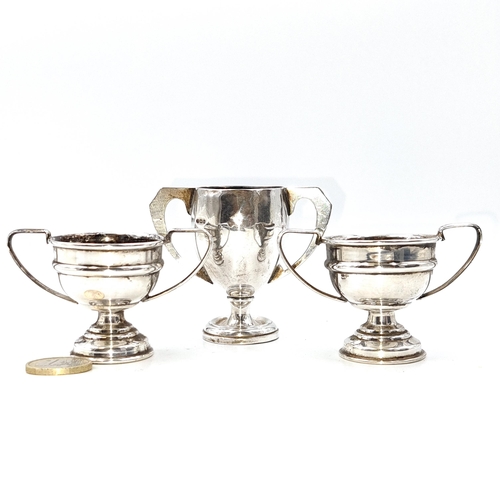 11 - A collection of three silver trophy cups. One set x 2. Total weight - 54.4 grams. Together with a la... 