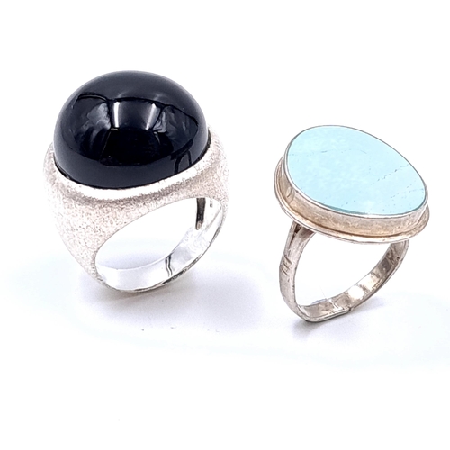 24 - A sterling silver polished stone ring (Ring size - P, Weight - 5.64 grams) together with a cabochon ... 