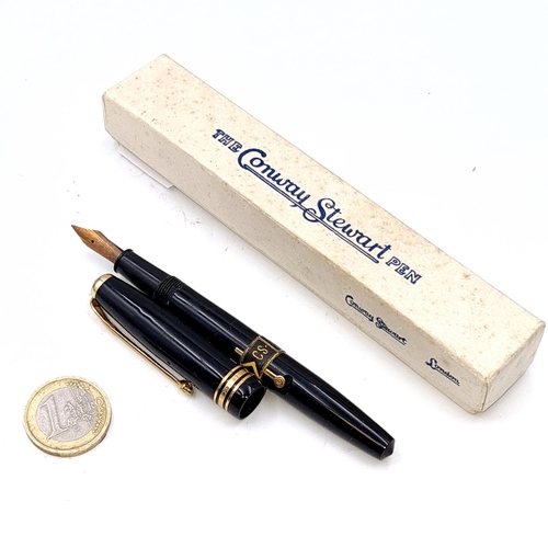 26 - A vintage Conway Stuart fountain pen with 14 carat gold nib with black resin body in gold metal deta... 
