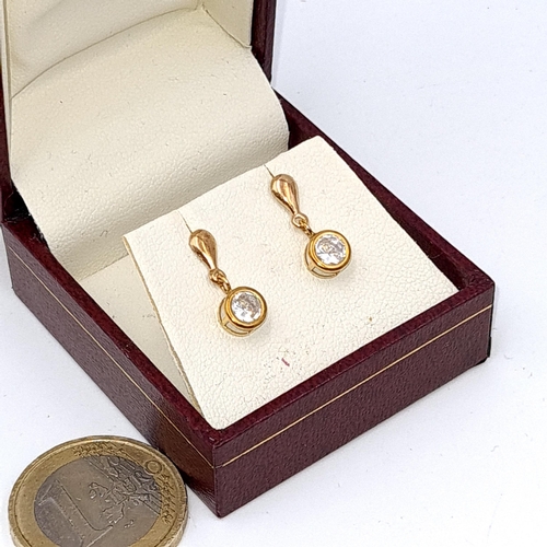 32 - A pair of nine carat gold gem set stud earrings. Boxed.