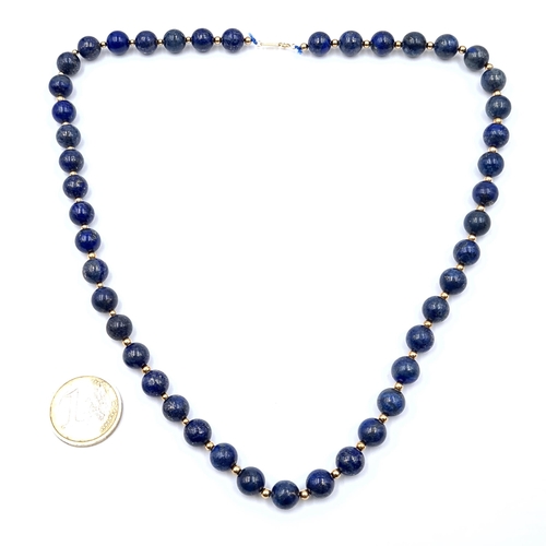 41 - Star Lot: An 18ct Gold Lapis Lazuli necklace with gold spaces. Together with a clasp marked AU750. L... 