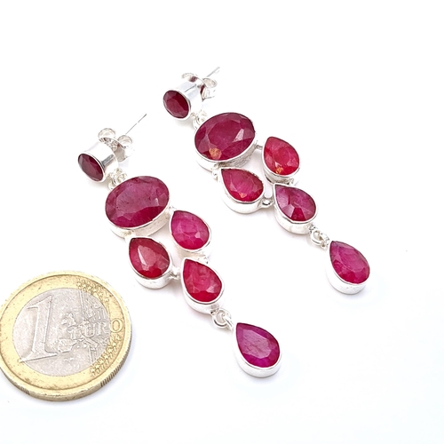 43 - A pair of ruby gemstone drop stud earrings set in sterling silver. Drop - 6 cms. Weight - 14.5 grams... 