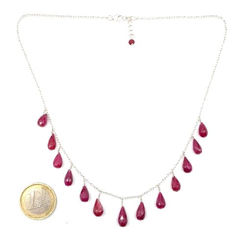 49 - A very pretty teardrop graduated  natural ruby pendant necklace set with a sterling silver chain. Le... 