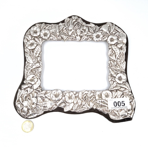 5 - A handsome Sterling Silver picture frame set with intricate repoussé border hallmarked London  20 x ... 