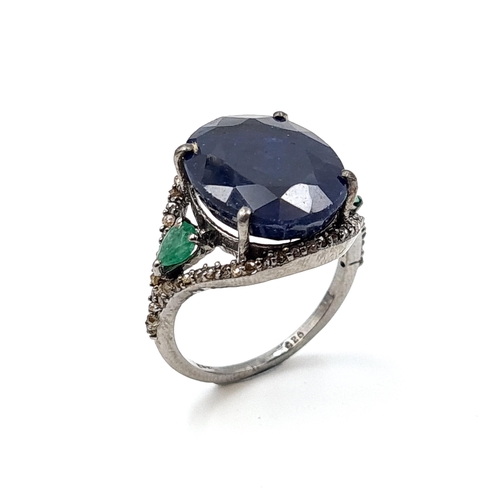 50 - Star Lot : A very attractive natural sapphire gemstone ring set with emerald shoulders and diamond s... 