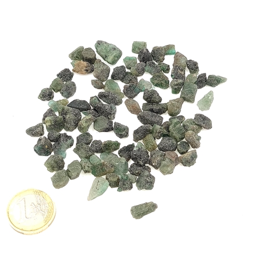 54 - A collection of rough emerald gemstones with a total weight of 256 carats.