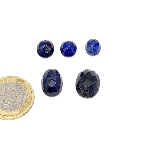 60 - A collection of blue facet cut sapphires. Weight - 32 carats.