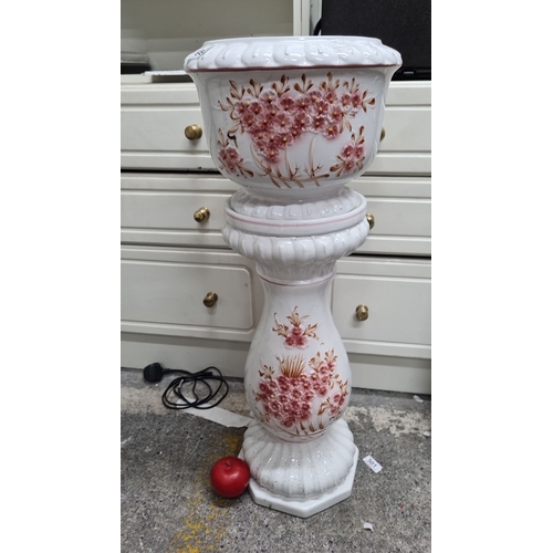 684 - A beautiful hand-painted ceramic planter and pedestal stand featuring floral motifs in pink and gold... 